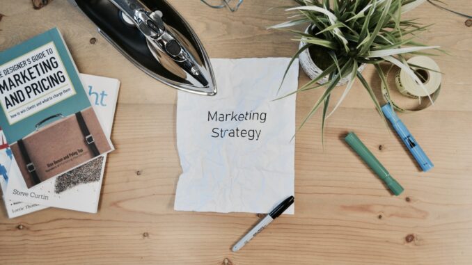Photo by Campaign Creators white printing paper with Marketing Strategy text